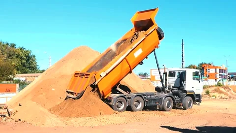 The excavator loading crushed stone into a dump truck in a crushed stone quarry Stock Footage 228733308