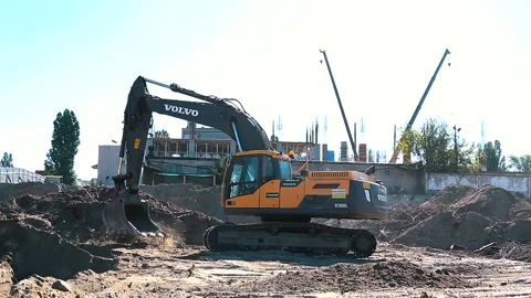 The excavator loading crushed stone into a dump truck in a crushed stone quarry Stock Footage 228733438