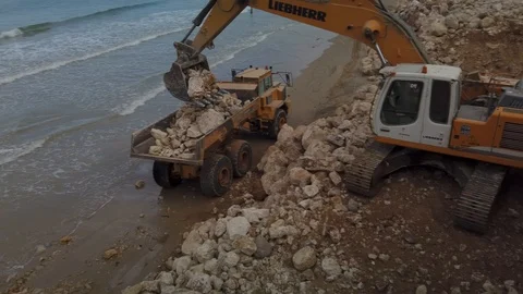 Excavator loading a dump truck Stock Footage 121216283