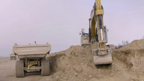 Excavator Loading Dump Truck Video stock 127035971