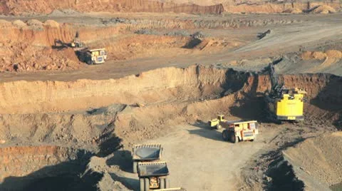 Excavator loading huge dump trucks Stock Footage 10757057