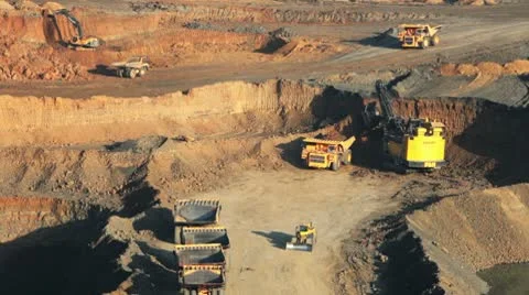 Excavator loading huge dump trucks Stock Footage 10767044