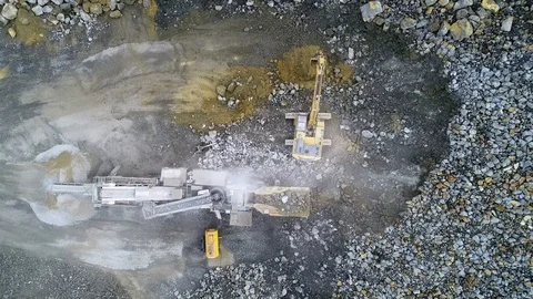 Excavator loading rock into crusher 1 動画素材 115735686