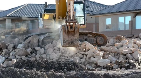 Excavator loading rocks and boulders into a truck. Stock-Footage 43392572
