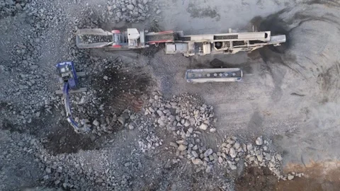 Excavator Loading Rocks into Crusher in Finland Stock Footage 339106391