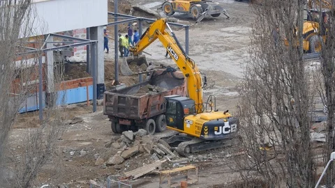 Excavator Loading Rocks Into A Truck Stock Footage 87184234