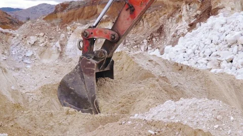 Excavator loading sand in a mine. Stock Footage 123180008
