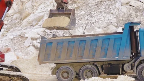 Excavator loading sand in a mine. Stock Footage 123180056