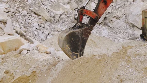 Excavator loading sand in a mine. Stock Footage 123180239
