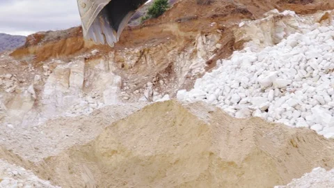 Excavator loading sand in a mine. Stock Footage 123180297