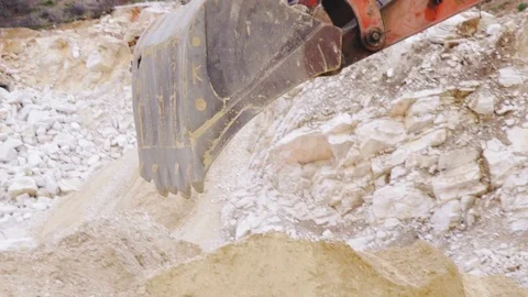 Excavator loading sand in a mine. Stock Footage 123180393