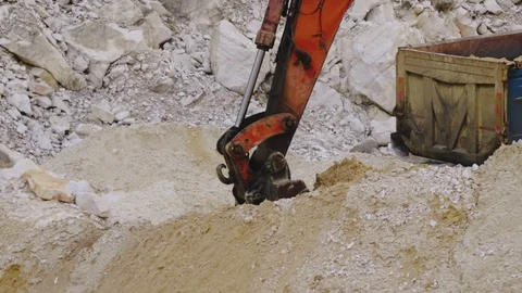 Excavator loading sand in a mine. Stock Footage 123180415