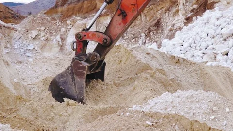 Excavator loading sand in a mine. Stock Footage 123180448