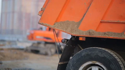 Excavator loading sand into a truck Stock Footage 63169776