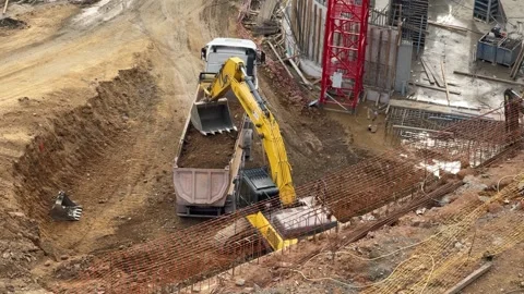 Excavator Loading Soil Into Dump Truck Tipper On Site Stock Footage 336524215