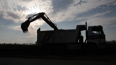 Excavator loading a truck Stock Footage 34383902