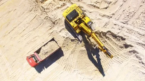 Excavator loading a truck. Video stock 71974692