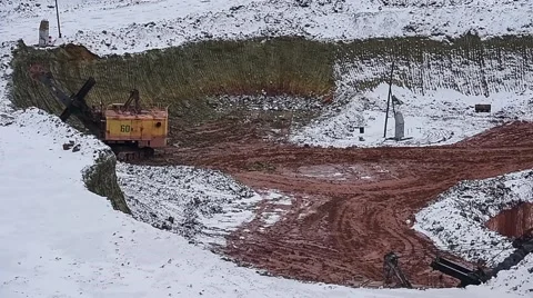 Excavator loads ore into dump-truck. Winter. Stock Footage 63545361