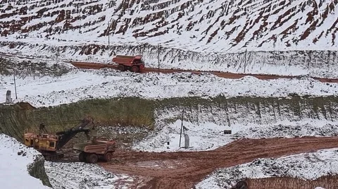 Excavator loads ore into dump-truck. Winter. Stock Footage 63545366