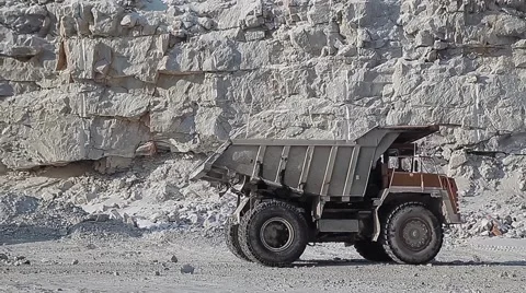 Excavator loads ore into dump-trucks. Stock Footage 63545658