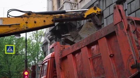 Excavator Loads Soil in the Dump Truck HD Stock Footage 249727408