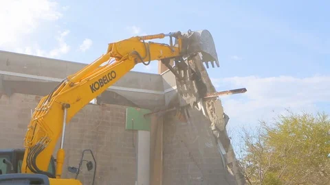 Excavator machine breaking down wall for building demolition B 스톡 동영상 114925343