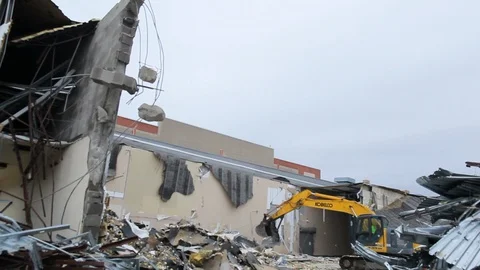 Excavator machine moving rubble scrap to a pile from building demolition A 스톡 동영상 114926051