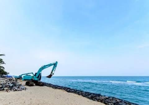 Excavator machine with raised bucket Stock Photos
