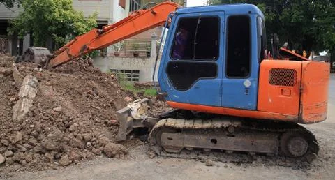 Excavator machine scoping dirt Stock Photos