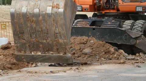 Excavator machine unloading sand at eathmoving works in construction site Stock Footage 11958554