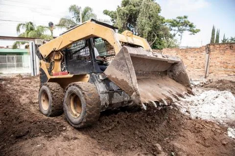 Excavator machine working on during a construction. Stock Photos