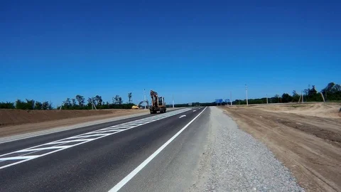 Excavator in motion on the road Stock Footage 90904026