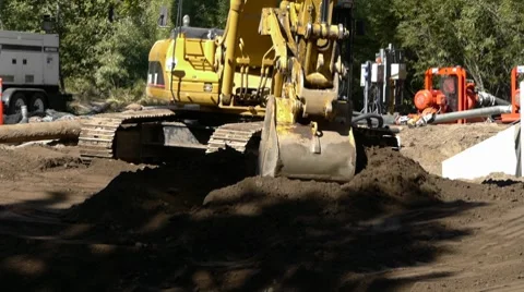 Excavator moving dirt Stock Footage 8684027