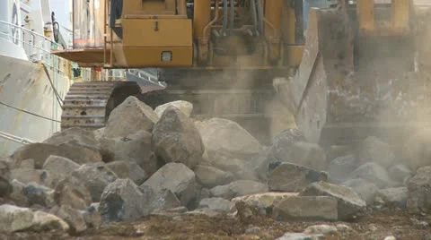 Excavator moving large rocks Stock Footage 10812460