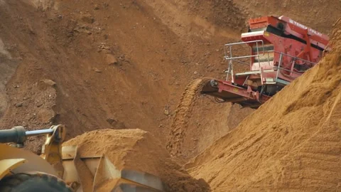 Excavator is moving sand . View of using of heavy equipment for sand and gravel 스톡 동영상 237184056