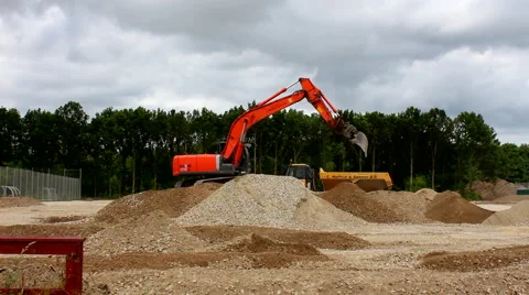 Excavator moving sand while doing construction work Video stock 52544829