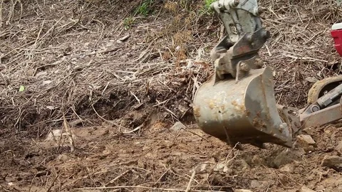 Excavator operating and digging soil for new electricity line. 库存影片 81470189
