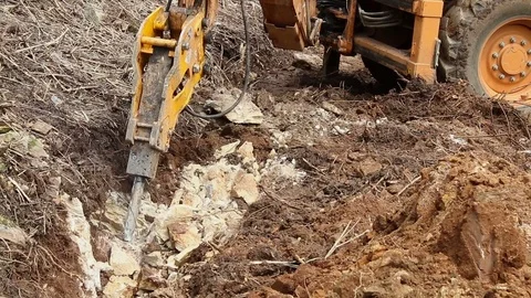 Excavator operating and digging soil for new electricity line. Stock-Footage 81470337