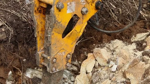Excavator operating and digging soil for new electricity line. 库存影片 81471032