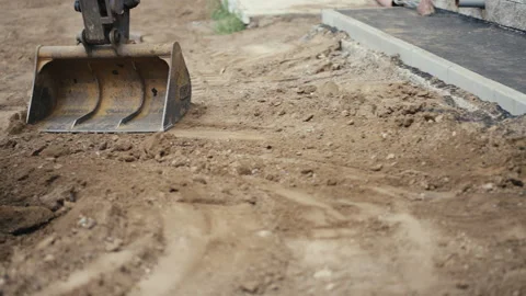 Excavator is operating onsite, performing various excavation and building tasks Stock Footage 312459745