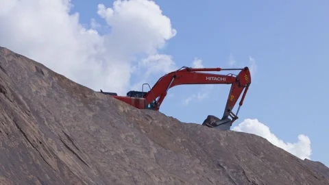 Excavator in operation against the sky. Stock Footage 249378437