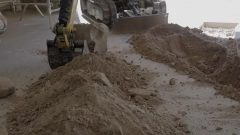 Excavator picking up large rock Stock Footage 289241437