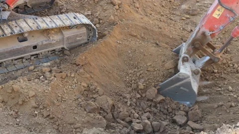 Excavator picks up soil Video stock 224683428