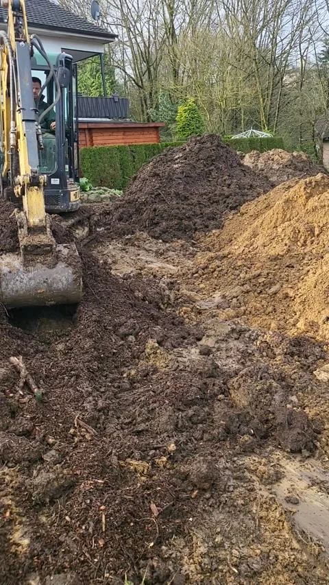 Excavator Power: A Construction Worker Operates a Heavy Machine on a Job Site Stock Footage 269788326