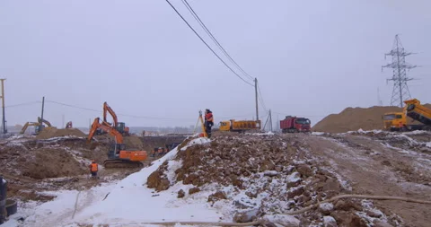 Excavator remove a layer of earth to build the foundation  Stock Footage 161950360
