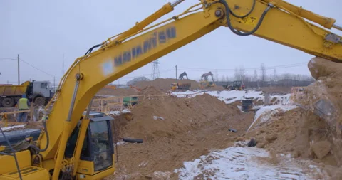 Excavator remove a layer of earth to build the foundation  Stock Footage 161950738