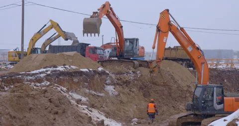 Excavator remove a layer of earth to build the foundation  Stock Footage 161950741