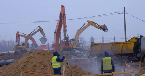 Excavator remove a layer of earth to build the foundation  Stock Footage 161951307