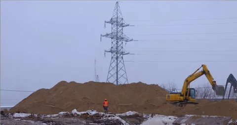 Excavator removes a layer of earth for the foundation of the future building Stock Footage 147600955