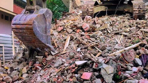 Excavator Removing Old Construction Rubble 2 Stock Footage 258625032
